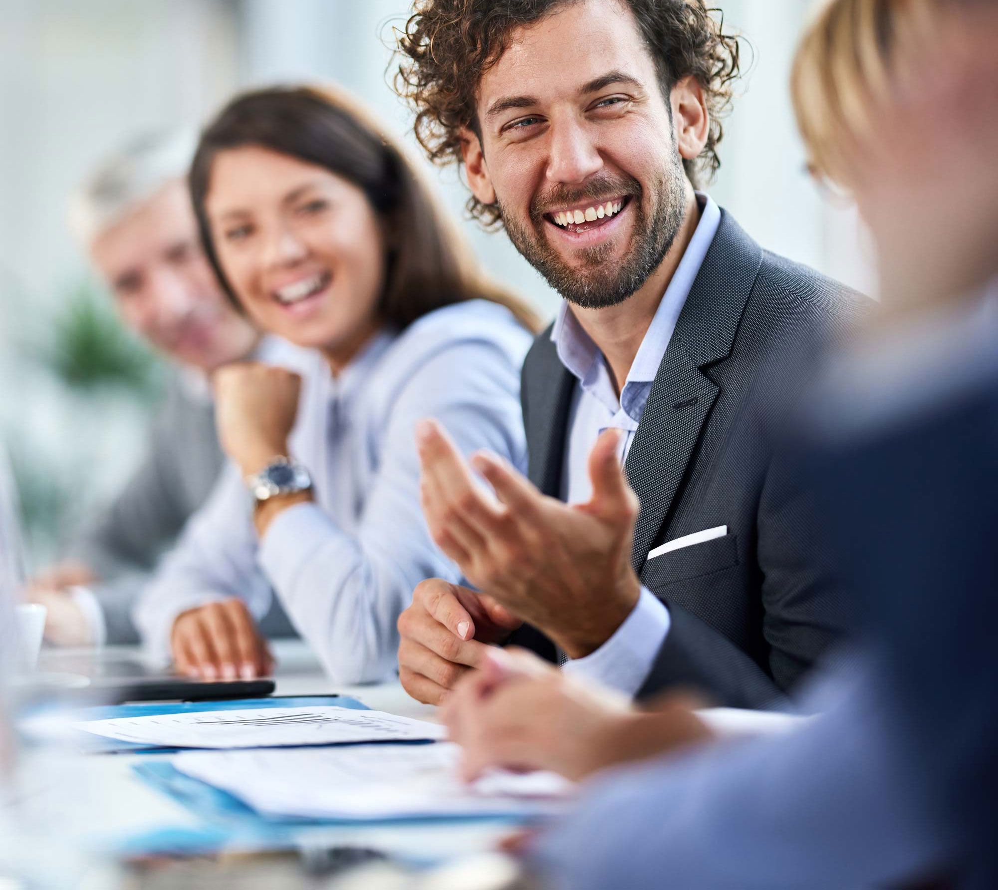 Executives smiling during a team meeting
